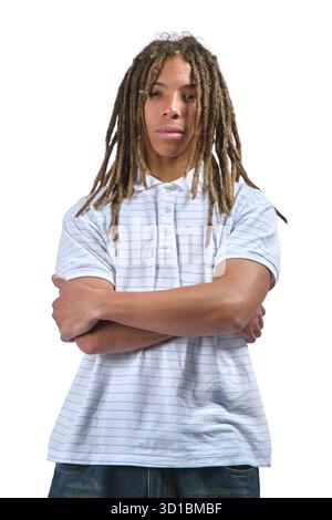 Young man with long dreadlocks and serious expression posing in a studio Stock Photo