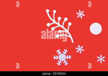 Christmas composition with decorative snowflakes on red background, copy space Stock Photo