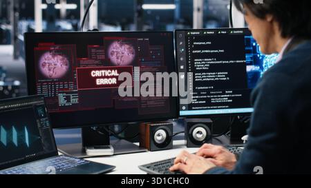 Team of engineers in data center struggles with malfunctions while using AI tools. Frustrated teamworking server hub colleagues try to fix system errors while using artificial intelligence, camera A Stock Photo
