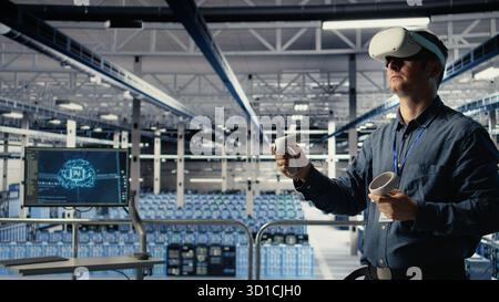 Data center system administrator uses virtual reality tech, improving AI rigs processing speed. Man in server farm wearing VR goggles to provide support for artificial intelligence workloads, camera A Stock Photo