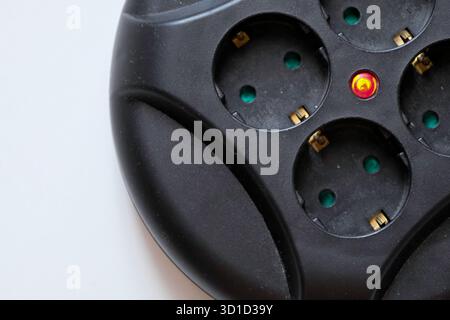 Rolled extension with a red light indicator signals Stock Photo