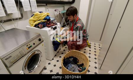 PRODUCTION - 23 October 2025, Lower Saxony, Osnabrück: Music student Vincent Jeremies lives in the smallest student hall of residence in Germany. It was a dream come true for him when he was given a place to live in the dormitory, which measures just 19 square meters. The mini house stands on the foundations of a former 12th century fortified tower and is centrally located in Osnabrück's city center. Photo: Jörn Hüneke/dpa Stock Photo