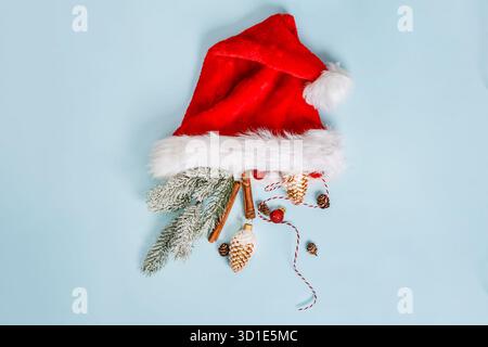 Christmas composition with holiday objects on a blue isolated background. Winter, new year concept. Flat lay, top view, copy space. Stock Photo