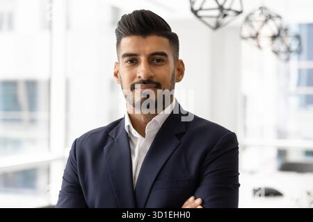 Portrait of confident young Indian business executive looking at camera Stock Photo