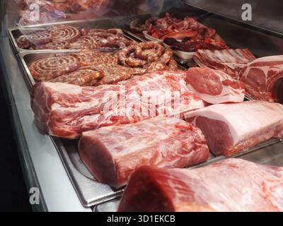 Red raw meat shop window. Fresh and cool meat collection. Meat market. Stock Photo