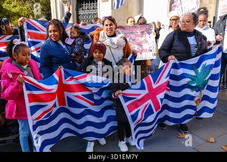 London, UK. 28th October, 2024. Members of the Chagossian community gather outside the Royal Courts of Justice ahead of an oral permission hearing seeking a full judicial review in a claim brought out by three Chagossian citizens who say the UK government has failed to satisfactorily consult the community over the handing over of the islands to Mauritius. Credit: Eleventh Hour Photography/Alamy Live News Stock Photo
