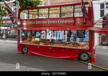 Great British Fudge Company red bus stall selling sweets in the town city centre York North Yorkshire England UK United Kingdom GB Great Britain Stock Photo