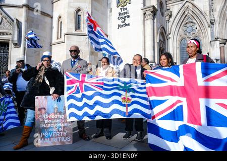 London, UK. 28th October, 2024. Members of the Chagossian community gather outside the Royal Courts of Justice ahead of an oral permission hearing seeking a full judicial review in a claim brought out by three Chagossian citizens who say the UK government has failed to satisfactorily consult the community over the handing over of the islands to Mauritius. Credit: Eleventh Hour Photography/Alamy Live News Stock Photo
