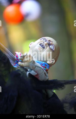Creepy Zombie Baby Halloween Decoration outdoors Stock Photo
