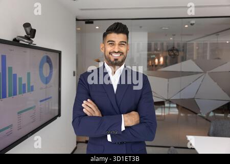 Happy handsome young product manager man posing for portrait Stock Photo