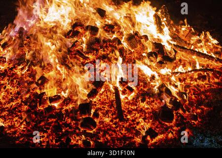 Burning coals from a fire abstract background Stock Photo