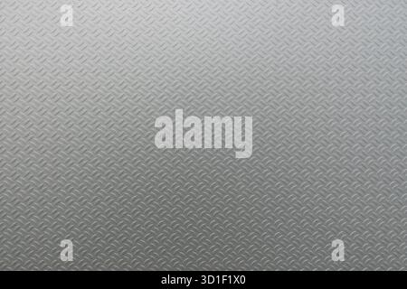 Textured diamond metal plate surface showing industrial background and pattern Stock Photo