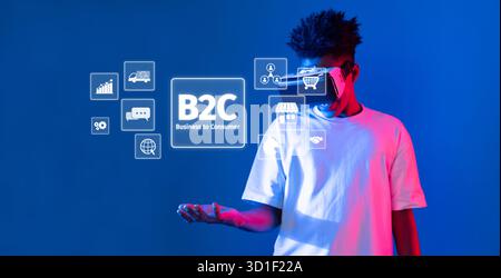 A young individual stands against a colorful backdrop, engaging with floating icons that represent the business to consumer model, symbolizing modern Stock Photo