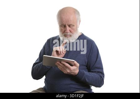 Funny bald and bearded old man using tablet computer, isolated on white Stock Photo