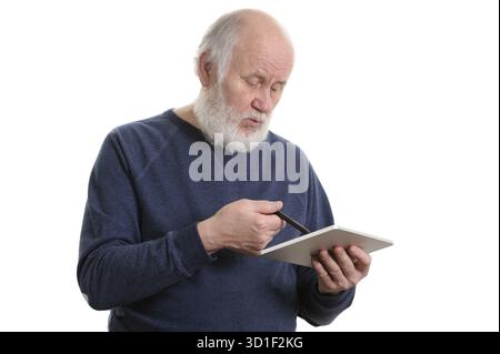 Funny bald and bearded old man using tablet computer, isolated on white Stock Photo