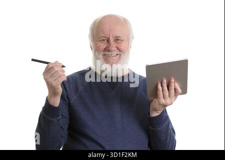 Funny bald and bearded old man using tablet computer, isolated on white Stock Photo