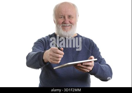 Funny bald and bearded old man using tablet computer, isolated on white Stock Photo
