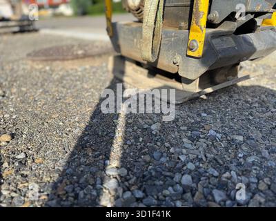 Piece of equipment is laying on the ground, with a yellow and black handle Stock Photo