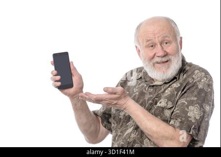 Senior upset bald and bearded white haired man showing something at smartphone screen, isolated on white background Stock Photo