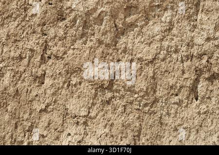 Yellow red clay earthen wall texture background Stock Photo