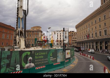 Street view showing the contrast between a historic building facade and the Metro Line C construction site. Barriers and signage. Stock Photo