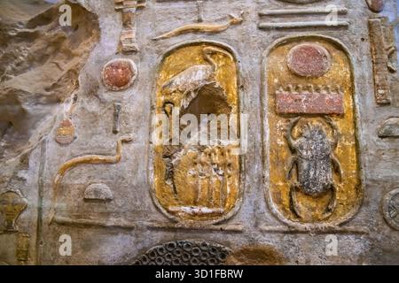 Old Egypt hieroglyphs carved on the stone wall in The Karnak Temple ...