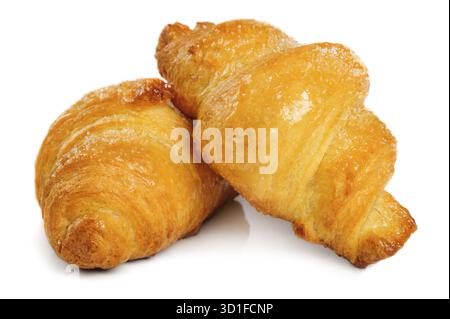 Two fresh just baked croissants on white background, isolated Stock Photo