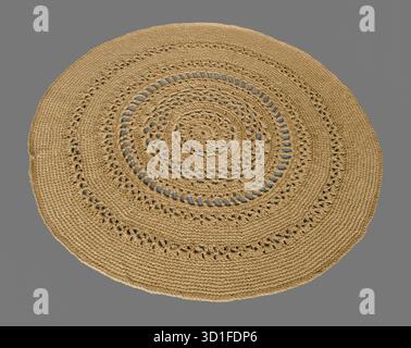 Round crocheted rug on a gray background Stock Photo