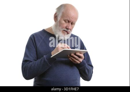 Funny bald and bearded old man using tablet computer, isolated on white Stock Photo