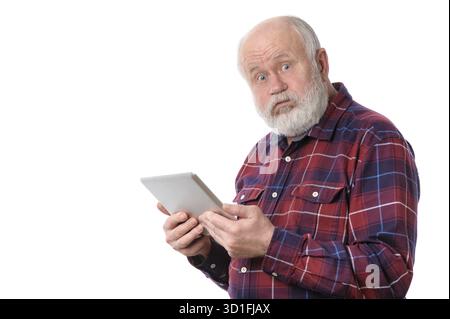Senior bald and bearded white haired man doing something with tablet computer, isolated on white background Stock Photo