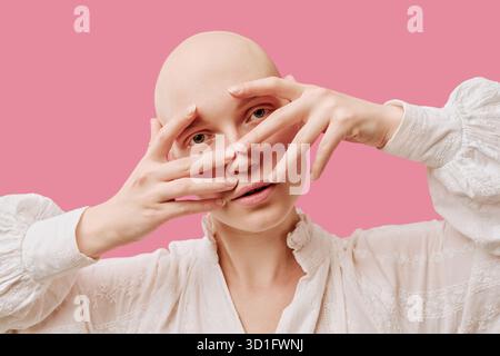 Portrait of Young Adult Woman Posing with Hands Framing Face Stock Photo
