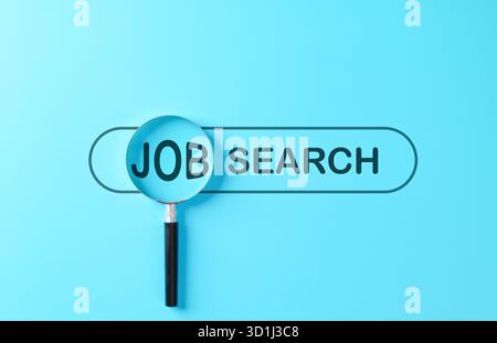 Job search concept with magnifying glass highlighting the word JOB on a blue background. Perfect for employment, hiring, modern recruitment platforms, Stock Photo