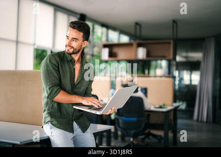 Software engineer using laptop computer with global network connection, Technology, innovation Stock Photo