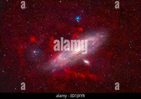 Deep sky wide field image reveals a field of glowing ionised hydrogen gas where the Andromeda Galaxy M31 is immersed in. Image captured from the Dark Sky Alqueva Observatory in Cumeada, Portugal. Stock Photo