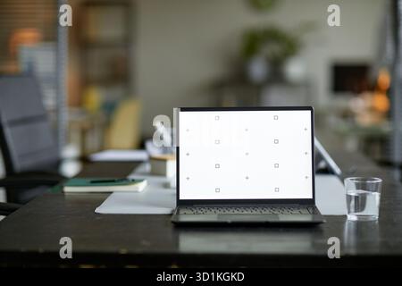 Laptop Computer Displaying Calibration Screen on Office Desk in Workspace Stock Photo