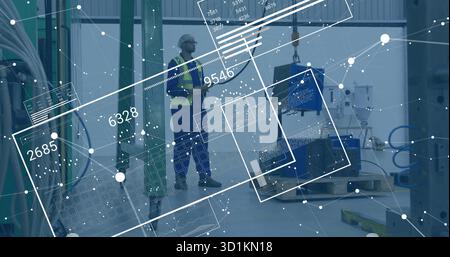 Factory tech in helmet and vest examining component hanging from crane hook, with data overlays Stock Photo