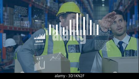 Analyzing warehouse team inspecting inventory with data overlay at distribution center, with boxes Stock Photo