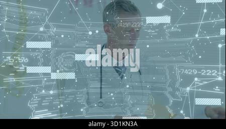 Standing doctor wearing lab coat using holographic interface in clinic, with stethoscope Stock Photo