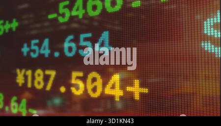Displaying colored numeric stock data on LED display on trading floor, featuring financial digits Stock Photo