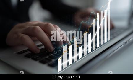 Professional focusing on financial growth through data analysis on a laptop. The image features dynamic graphs and visual elements showcasing business Stock Photo