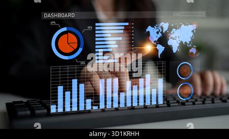 A focused businessperson interacts with a digital dashboard, analyzing various data visualizations and global maps to enhance strategic decision Stock Photo