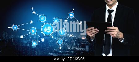 A business professional interacts with a digital tablet, analyzing key performance indicators in a modern urban setting, highlighting data-driven Stock Photo