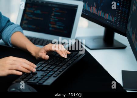 Cropped hands image of IT developer creating with typing information on pc with coding program information data website application, wearing jeans shi Stock Photo