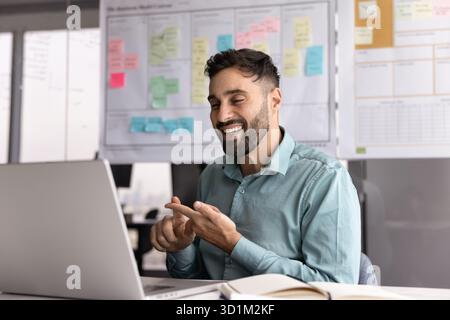 Businessman with hearing disability communicate by videocall using sign language Stock Photo