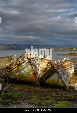 The old trawlers beached at Salen on The isle of Mull, Scotland. Stock Photo