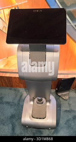 Berlin, Germany - June 11, 2025: Modern robotic kiosk features a touchscreen display in a sleek, contemporary environment. Stock Photo