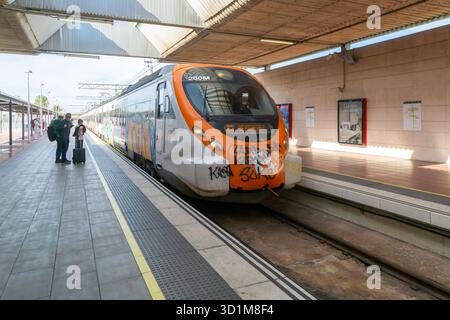 Renfe Civia commuter train at platform of Airport railway station, Rodalia de Barcelona suburban rail network, Barcelona, Catalonia, Spain, Europe Stock Photo