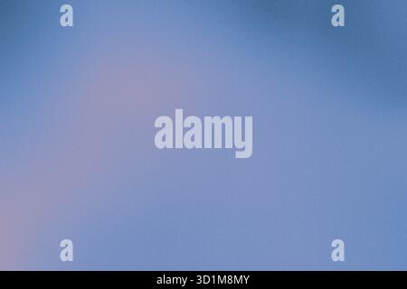 Blue gray pastel gradient background with added noise and subtle sand texture for a soft, tactile visual effect. Stock Photo