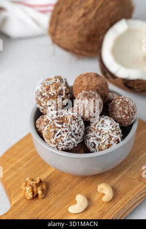Homemade vegan healthy sugar-free candies made from dried fruits and nuts. Healthy eating. Stock Photo