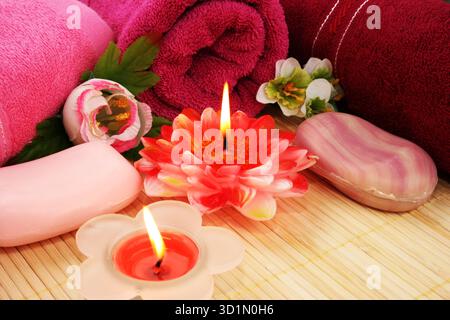 Towels, soaps, flowers, candles Stock Photo